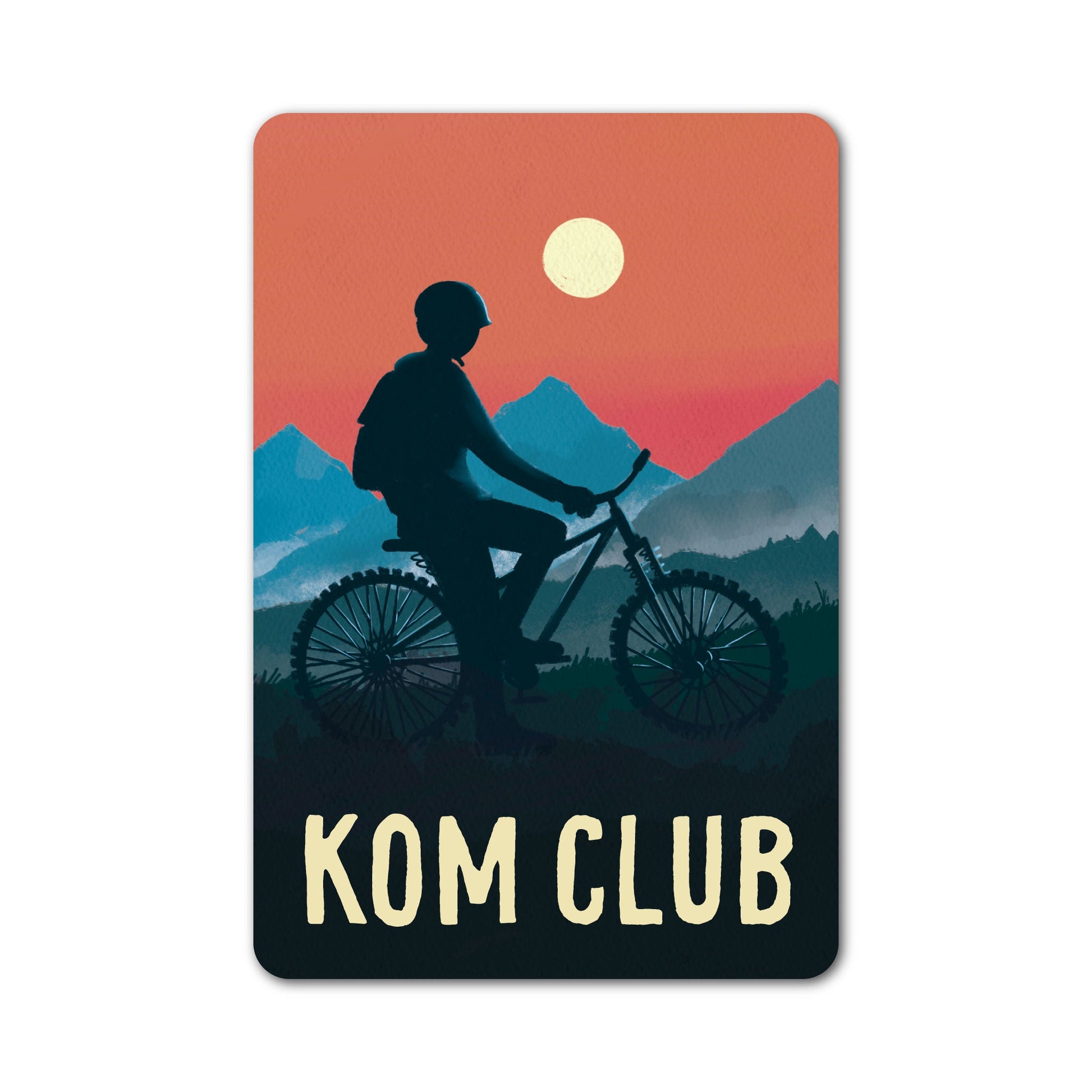 KOM Club cycling sticker with illustrated rider and sunset mountain scene.